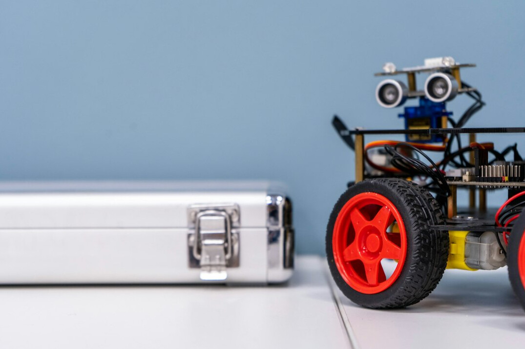 Robotics project with an exposed circuit board and laptop