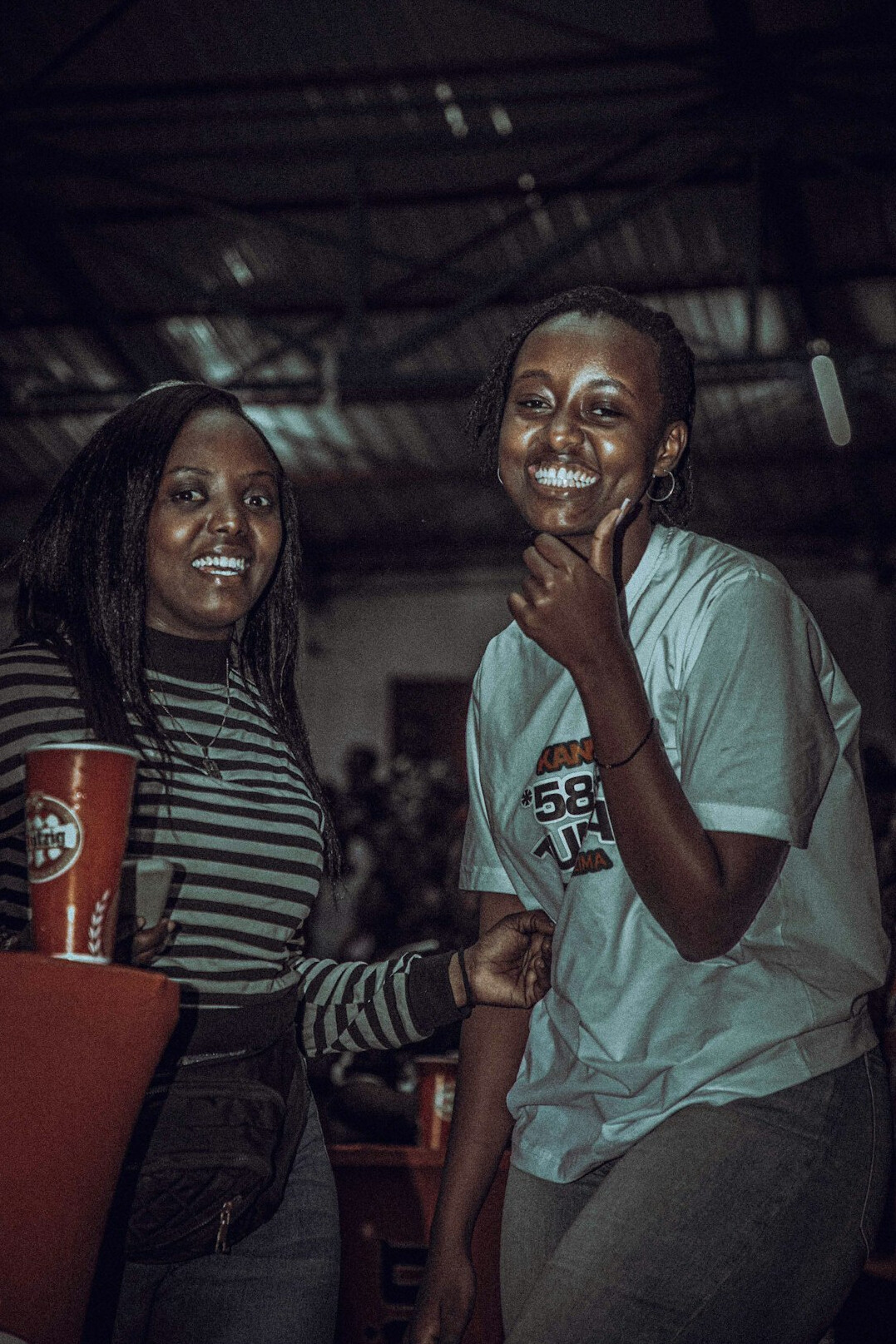 Two students celebrating after finishing a coding challenge