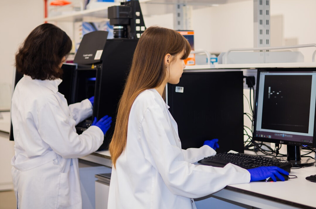 Rows of students coding in a computer lab