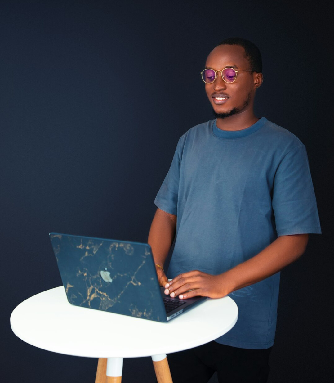 smiling coder with laptop